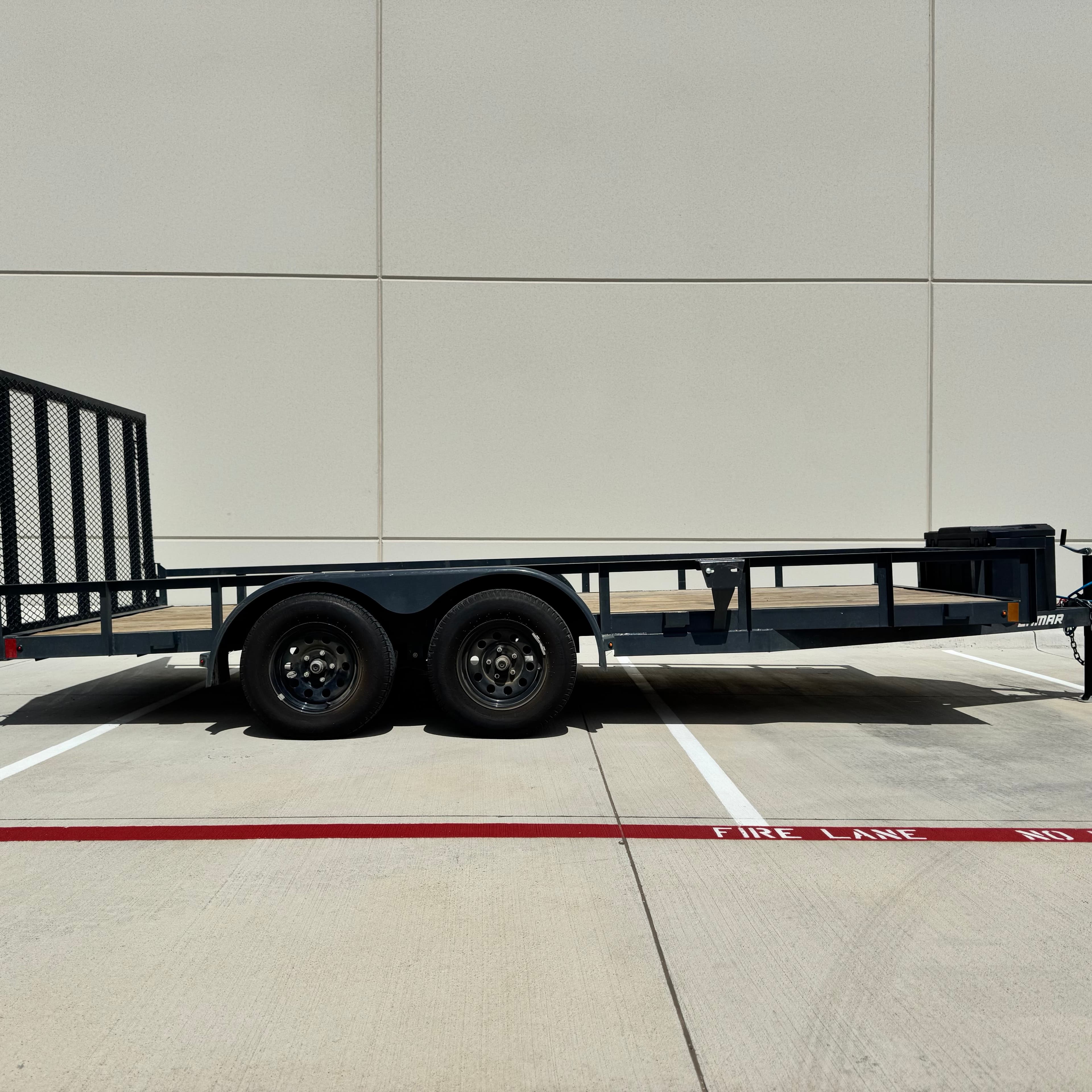 16ft utility trailer rental Haslet TX - versatile utility trailer with wooden deck and mesh ramp for landscaping hauling